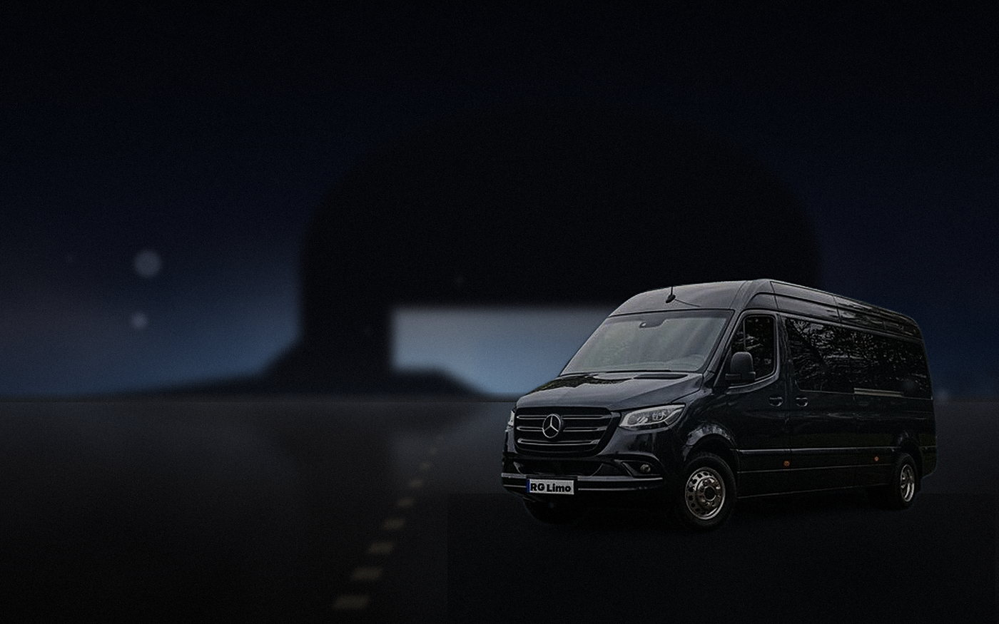 Black Mercedes-Benz Sprinter van beside a private terminal at Los Angeles International after dark