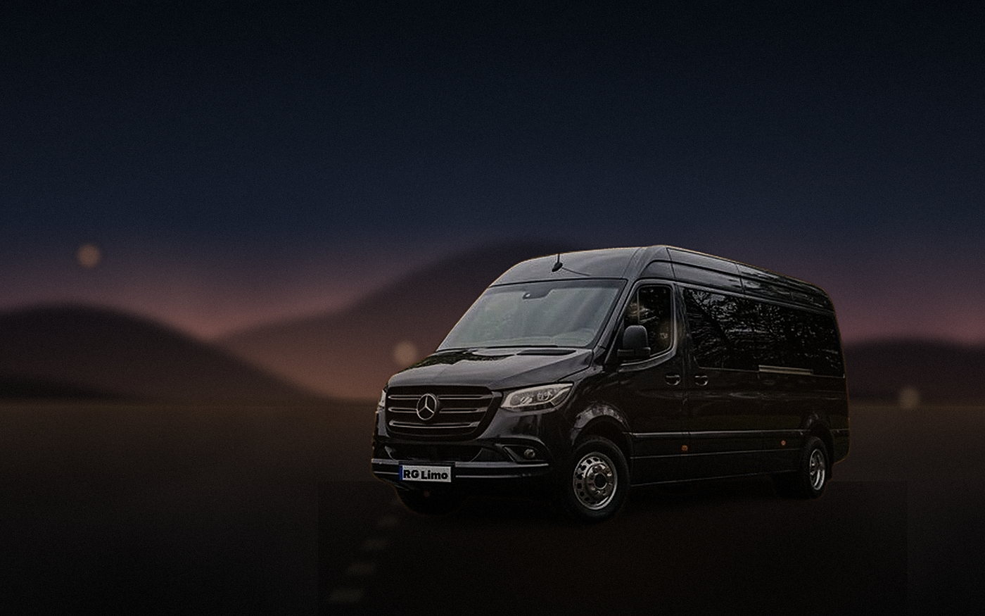 Black Mercedes-Benz Sprinter van parked on a desert access road under the first stars