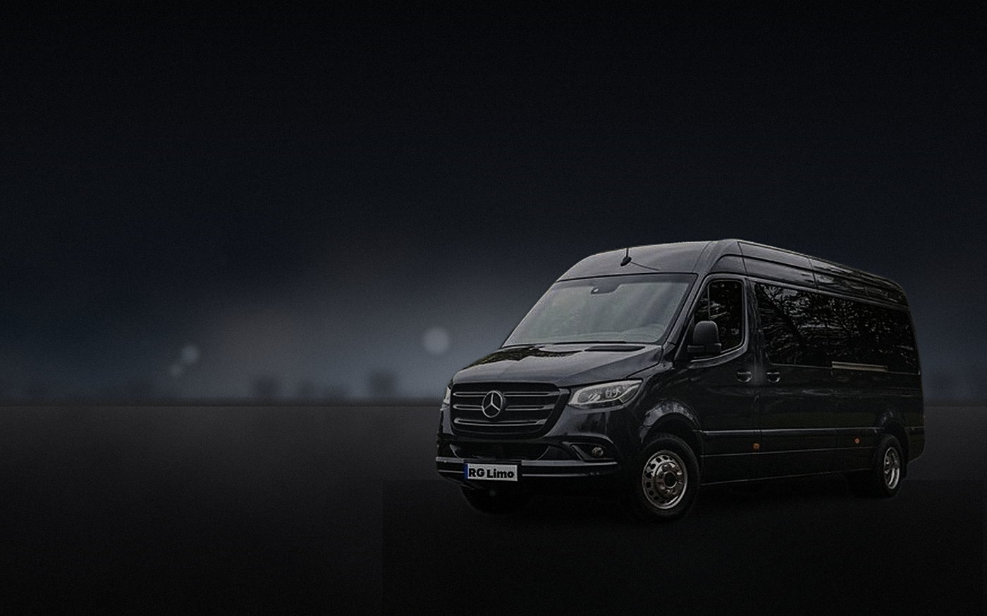 Black Mercedes-Benz Sprinter van standing by before a group transfer leaves Los Angeles