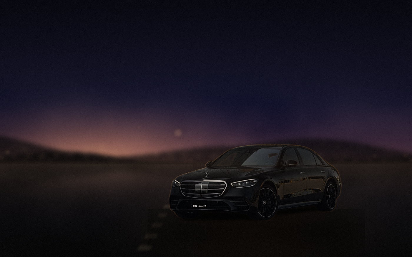Black Mercedes-Benz S-Class sedan on a canyon road above Malibu after sundown