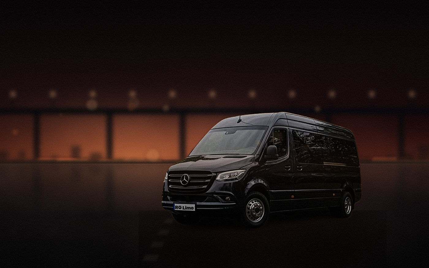 Black Mercedes-Benz Sprinter van running a group transfer across Los Angeles at sunset