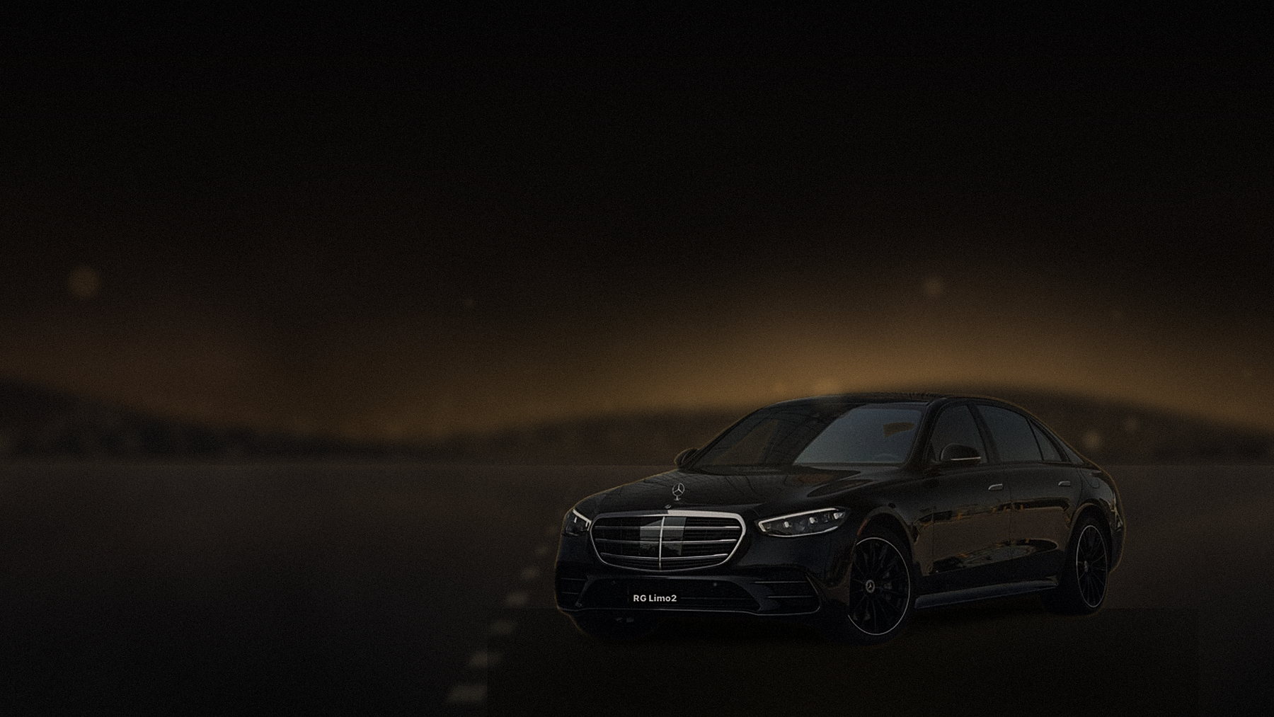 Black Mercedes-Benz S-Class sedan on a ridge road above Los Angeles with the basin lights below