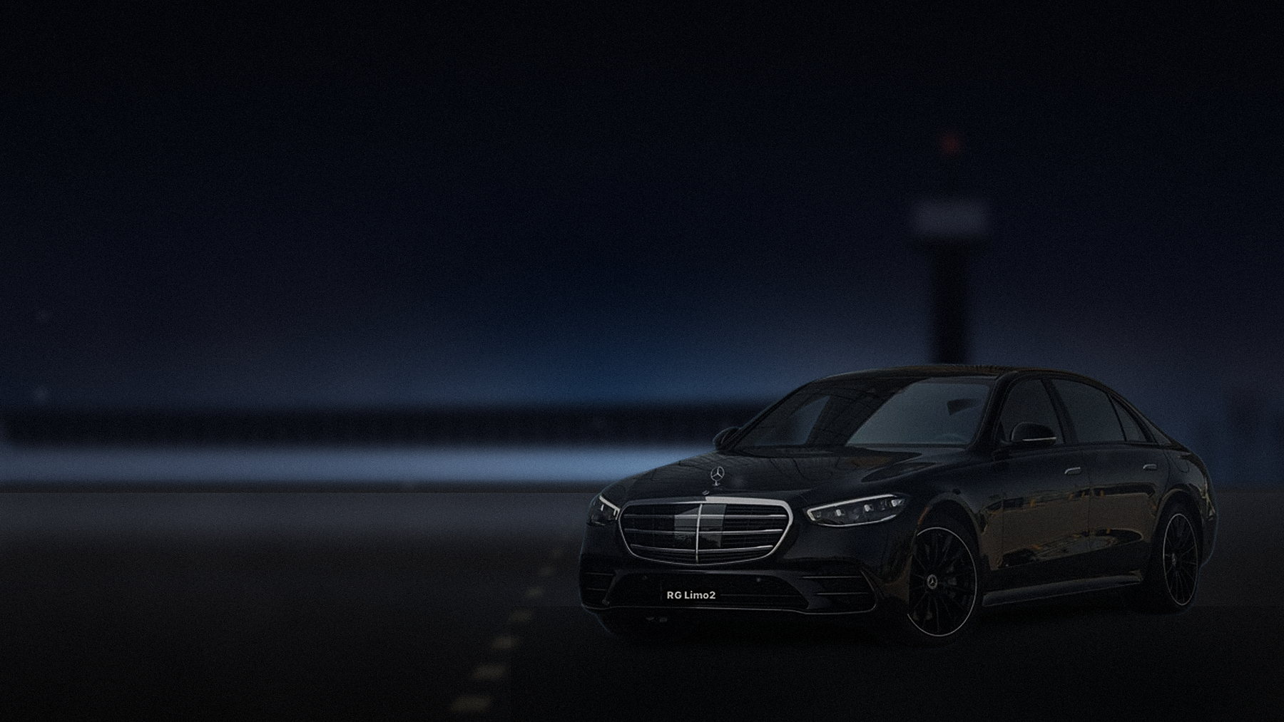 Black Mercedes-Benz S-Class sedan at the LAX departures kerb under terminal lights at night