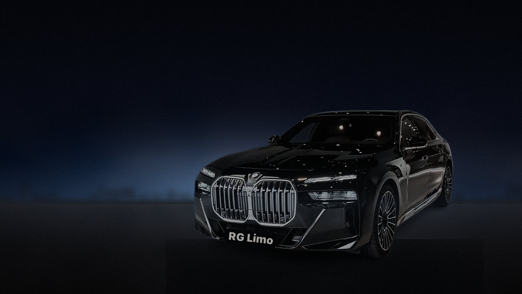 Black BMW X5 parked on an empty Los Angeles street late at night