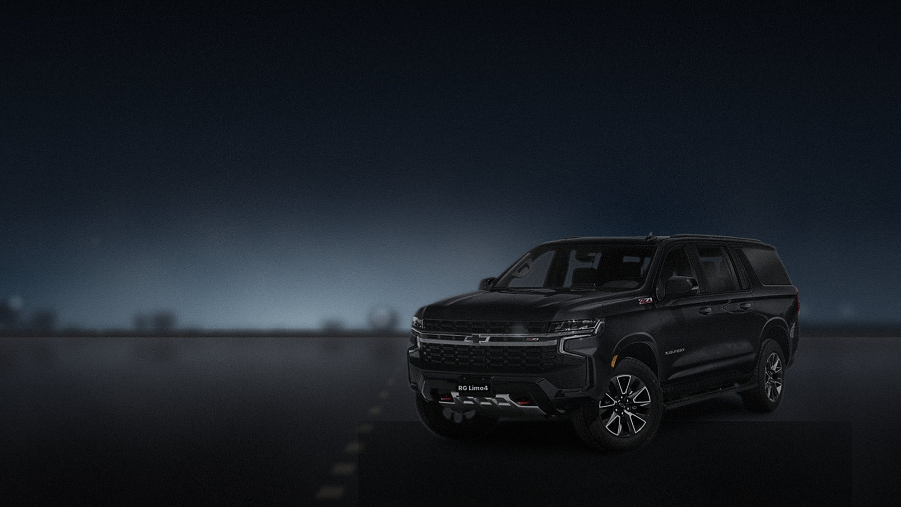 Black Chevrolet Suburban on the coast highway south of Los Angeles under a grey marine sky