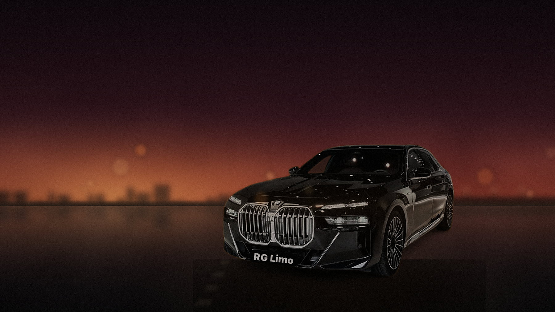 Black BMW X5 on Pacific Coast Highway at Malibu with the sun on the water