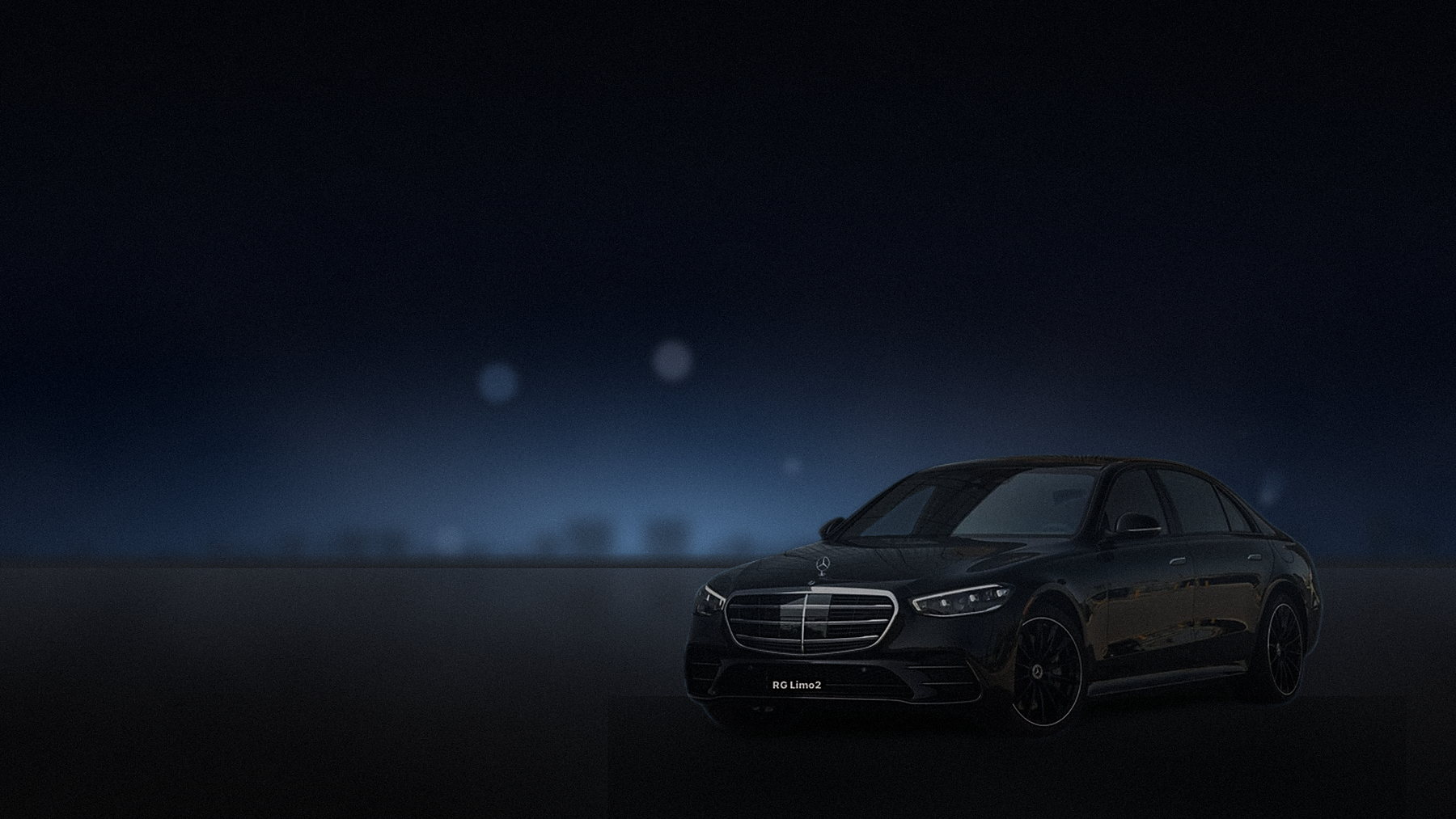 Black Mercedes-Benz S-Class sedan waiting at a Los Angeles kerb late at night
